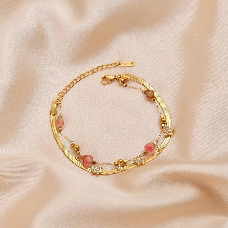 Luxury Gold Butterfly Charm Bracelet – Double-Layer Stainless Steel Chain with Pink Crystal Beads and CZ Stones - Lunelle London